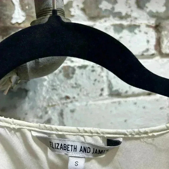 Elizabeth and James long sleeves, v neck peplum blouse in cream. Size Small. - Picture 2 of 9